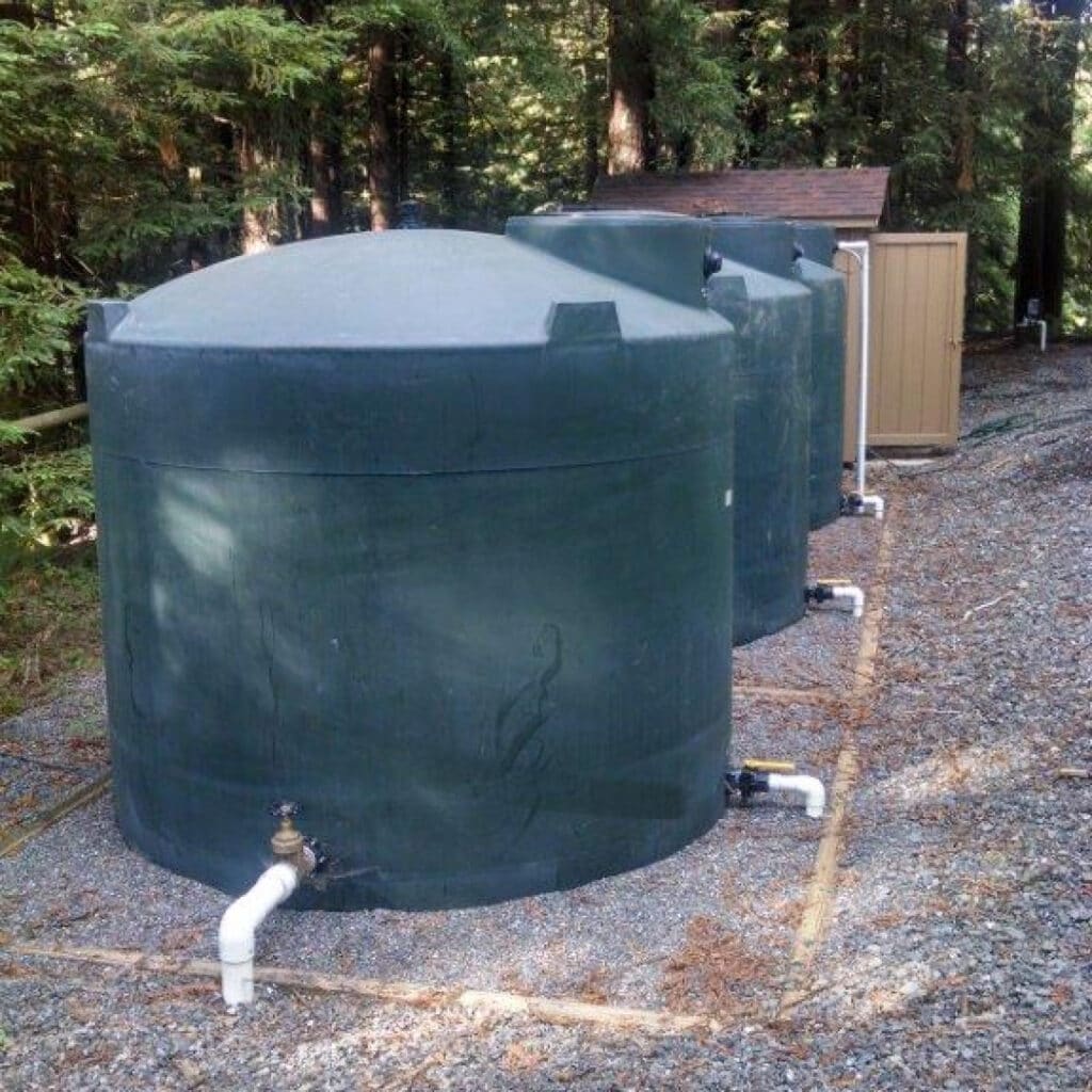 3 Large Water Storage Tanks In The Woods
