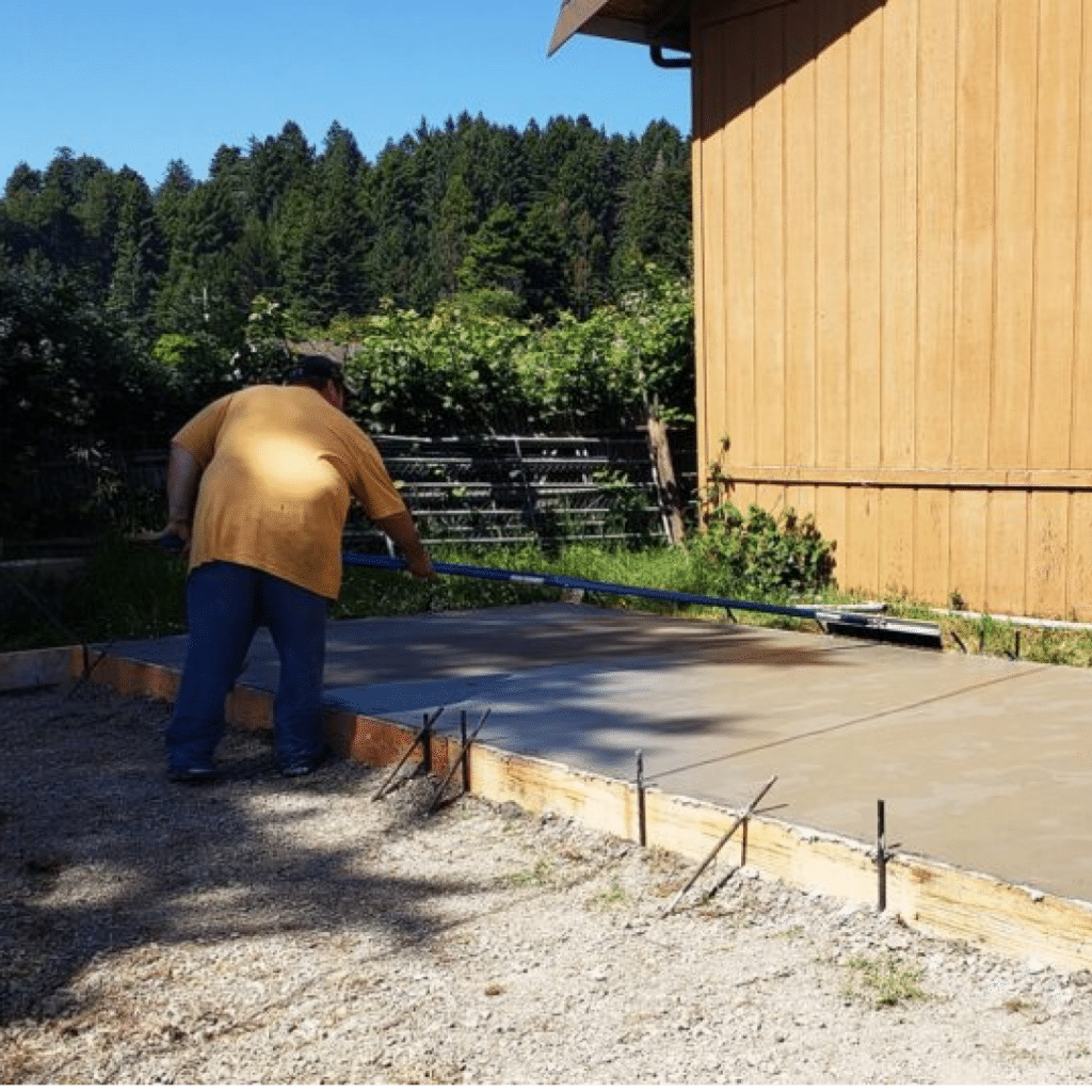 Man Smoothing Wet Concrete