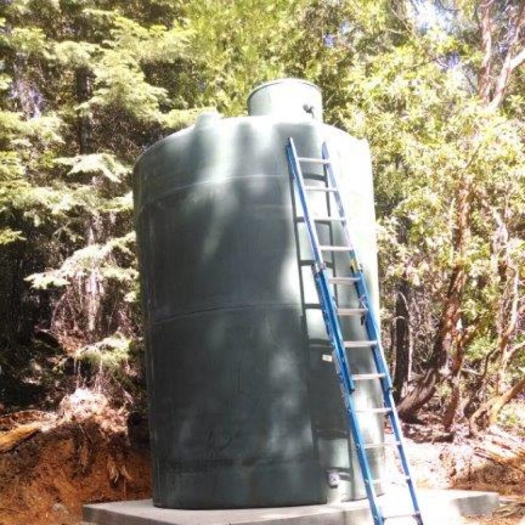 Ladder Leaning Against Large Water Storage Tank