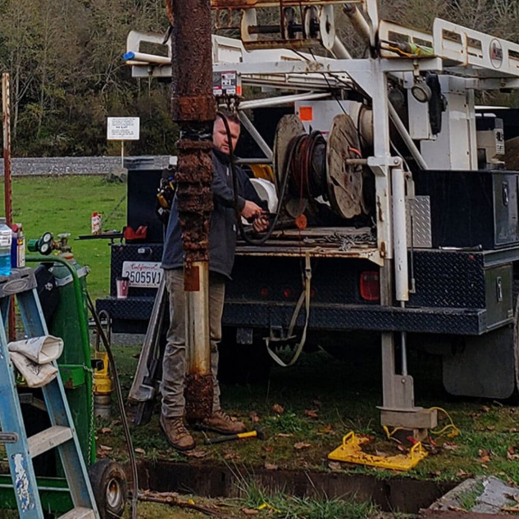 Man Working With Well Drilling Equipment